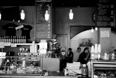 a black and white photo of a coffee shop