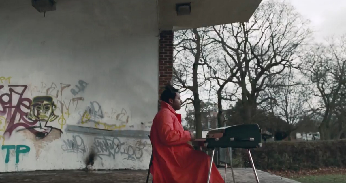 a woman in a red robe sitting at a table