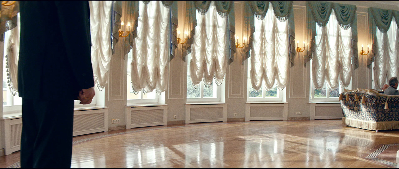 a man in a suit standing in a room