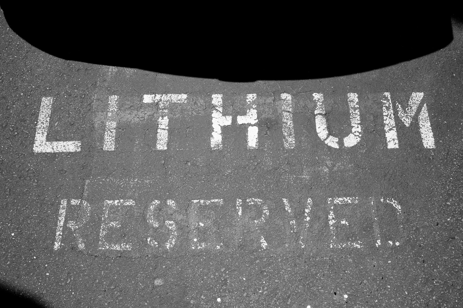 a black and white photo of a street sign