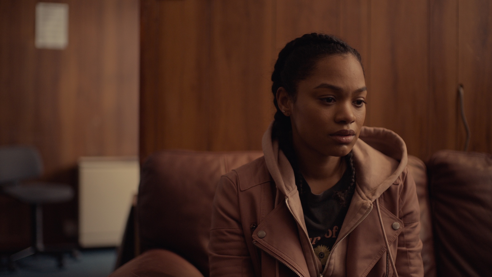 a woman sitting on a couch in a room