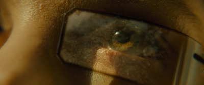 a close up of a person's face through a magnifying glass