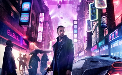 a man standing in the middle of a city at night