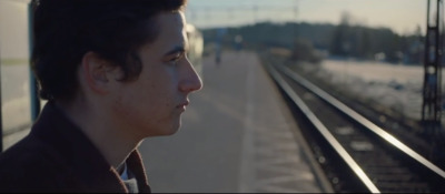 a man looking out of a train window