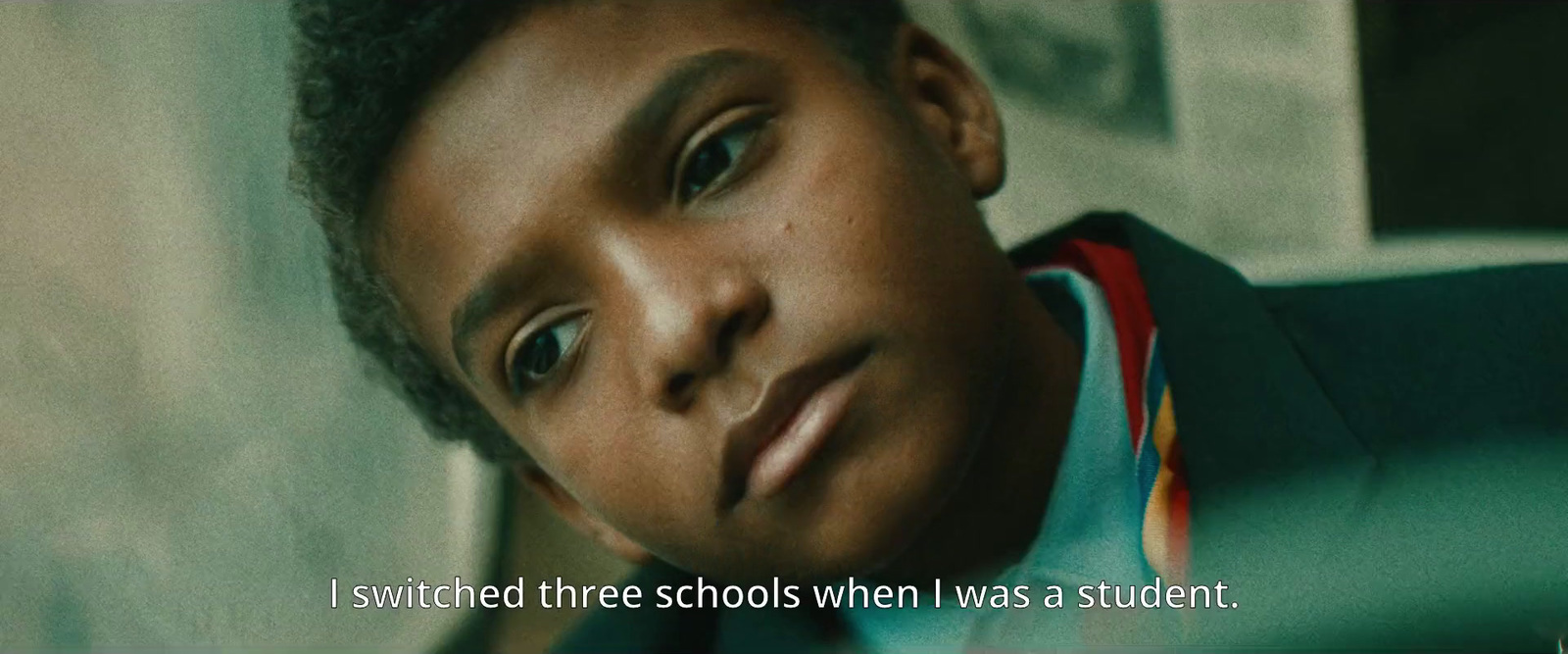 a young boy with a quote on his face