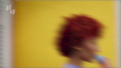 a blurry photo of a woman with red hair