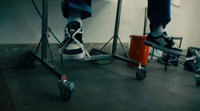 a person standing on top of a metal stand