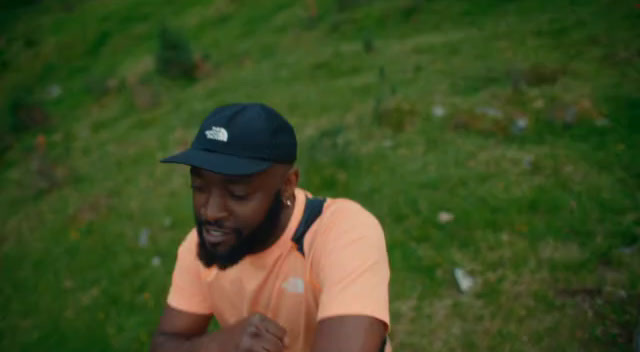 a man with a beard wearing a hat