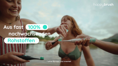 two women are brushing their teeth with green toothbrushes