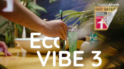 a person holding a green toothbrush over a table