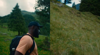 a man with a backpack is standing in a field