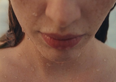 a close up of a woman with freckles on her face