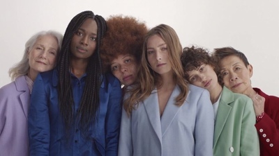 a group of women standing next to each other