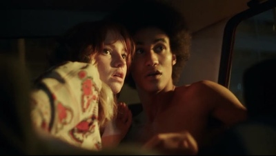 a couple of people that are sitting in a car