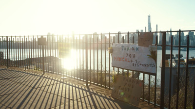 a fence that has some signs on it