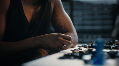 a person sitting at a table with a laptop