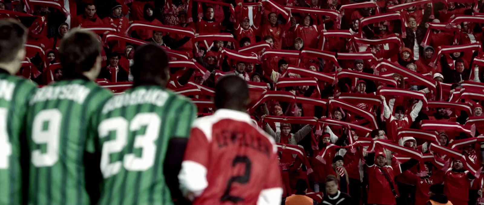 a group of people standing in front of a crowd