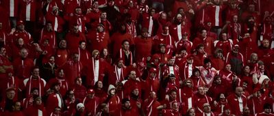 a large group of people in red uniforms