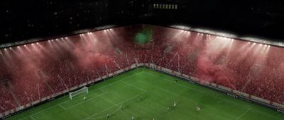 an aerial view of a soccer stadium at night