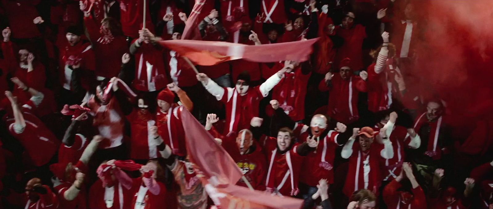 a large group of people in red robes