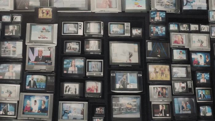 a wall covered in pictures and pictures of people