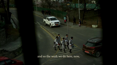 a group of young men walking across a street