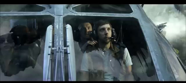 a man sitting in the cockpit of a helicopter