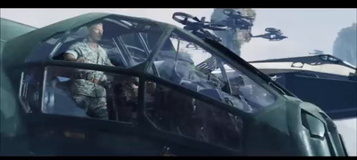 a man standing in the cockpit of a helicopter