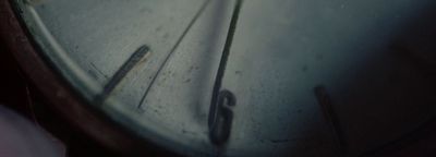 a close up of a clock face with a blurry background