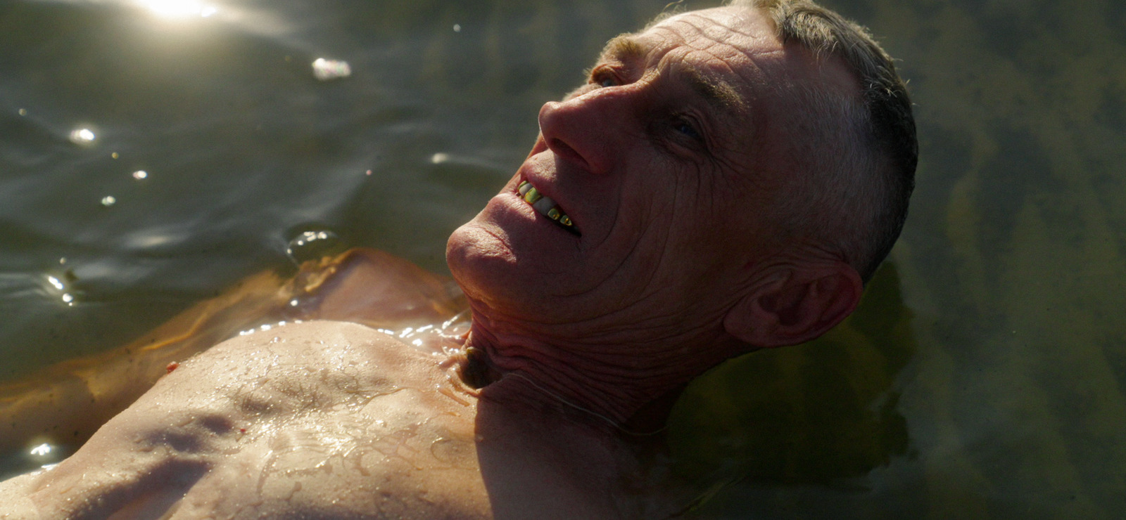 a man swimming in a body of water