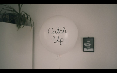 a balloon with the words catch up written on it