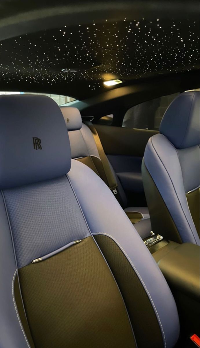 the interior of a car with blue and brown seats