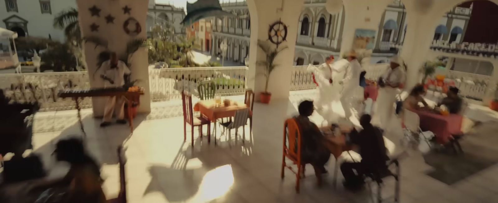 a group of people sitting around a table in a room