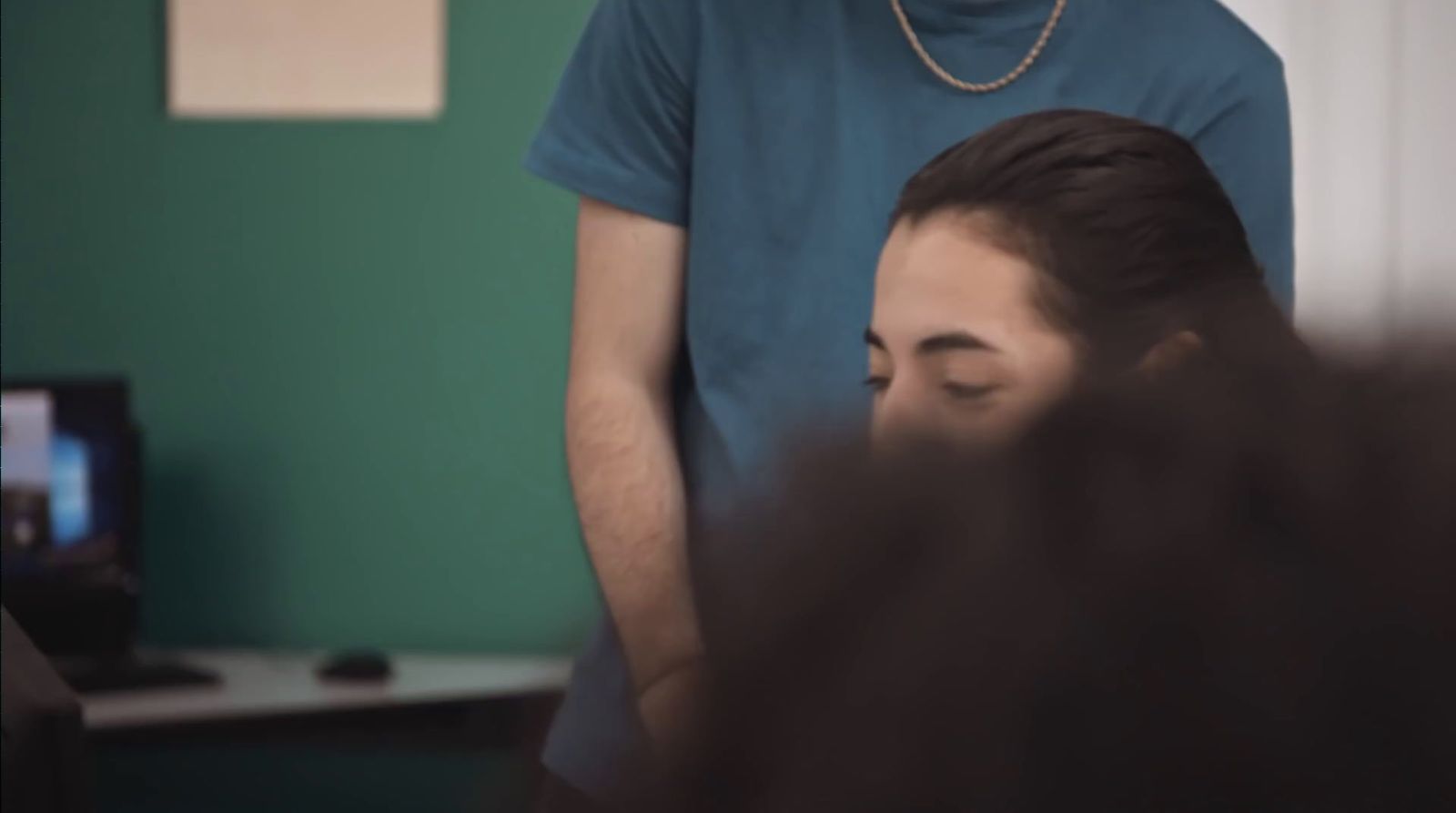 a man standing in front of a woman in a room