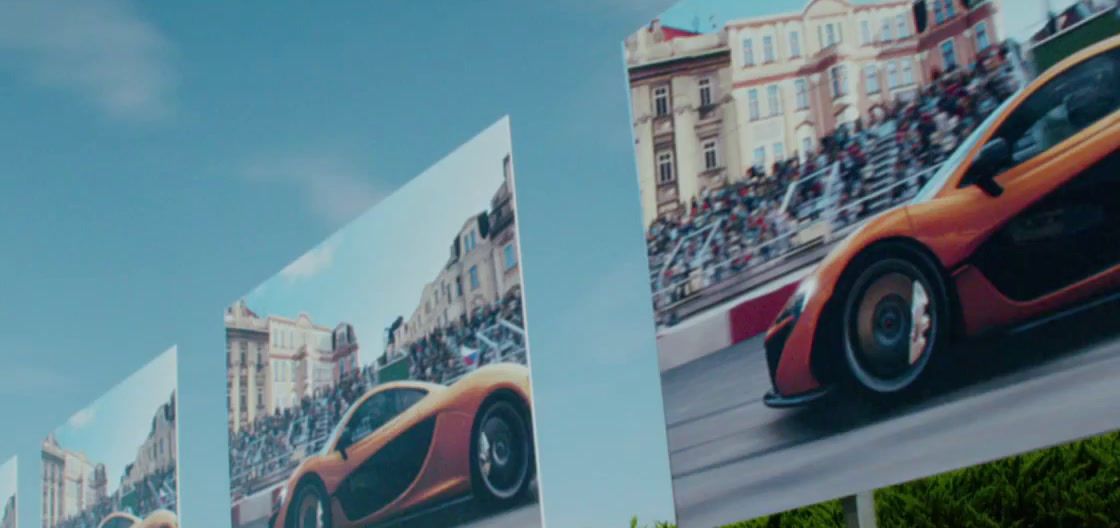 a large picture of a sports car on the side of a building