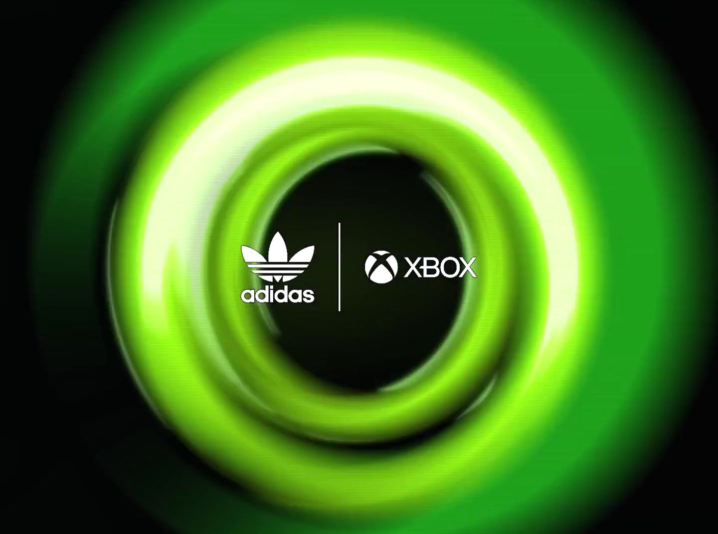 a green and black background with the adidas logo in the center