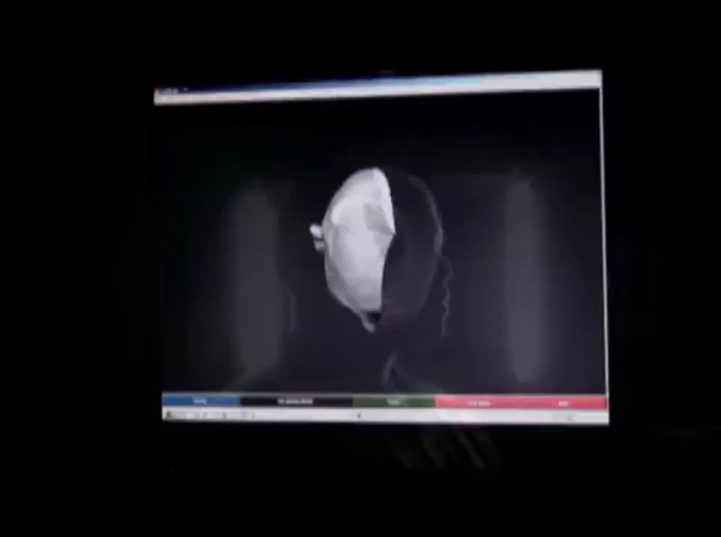 a computer screen with a picture of a person wearing a hat