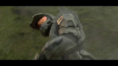 a man in a futuristic suit is in a field