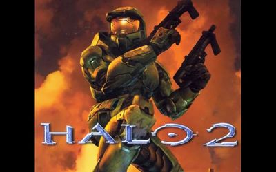 a poster of a halo 2 character holding a gun