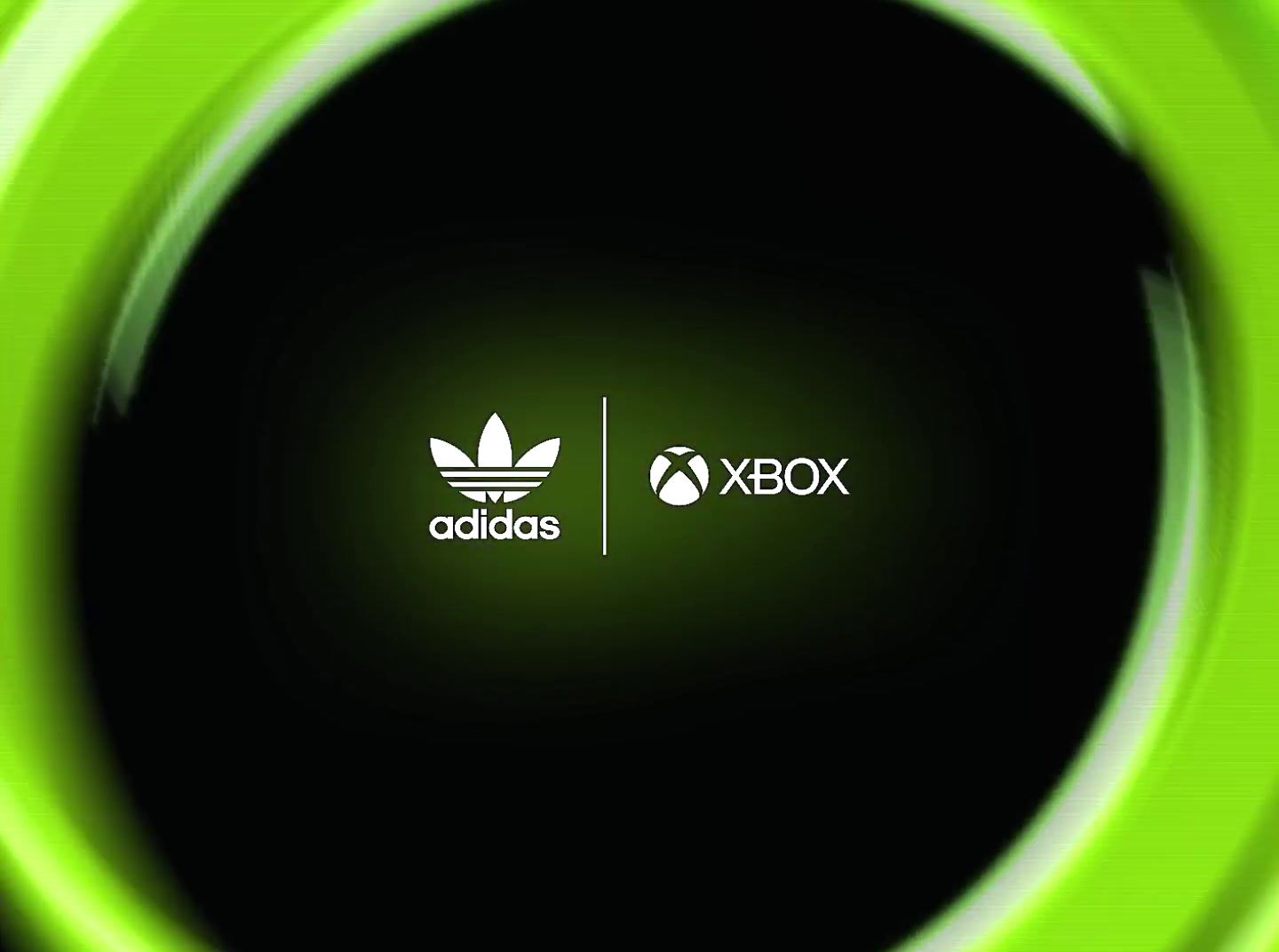 the adidas logo on a black and green background