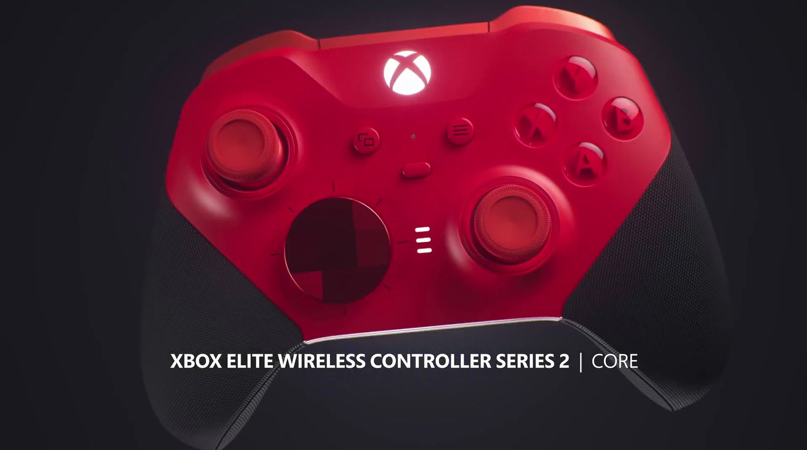 a close up of a red controller on a black background