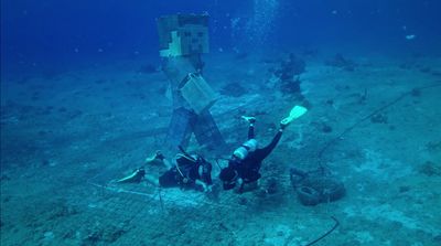 a man is standing on the bottom of a ship