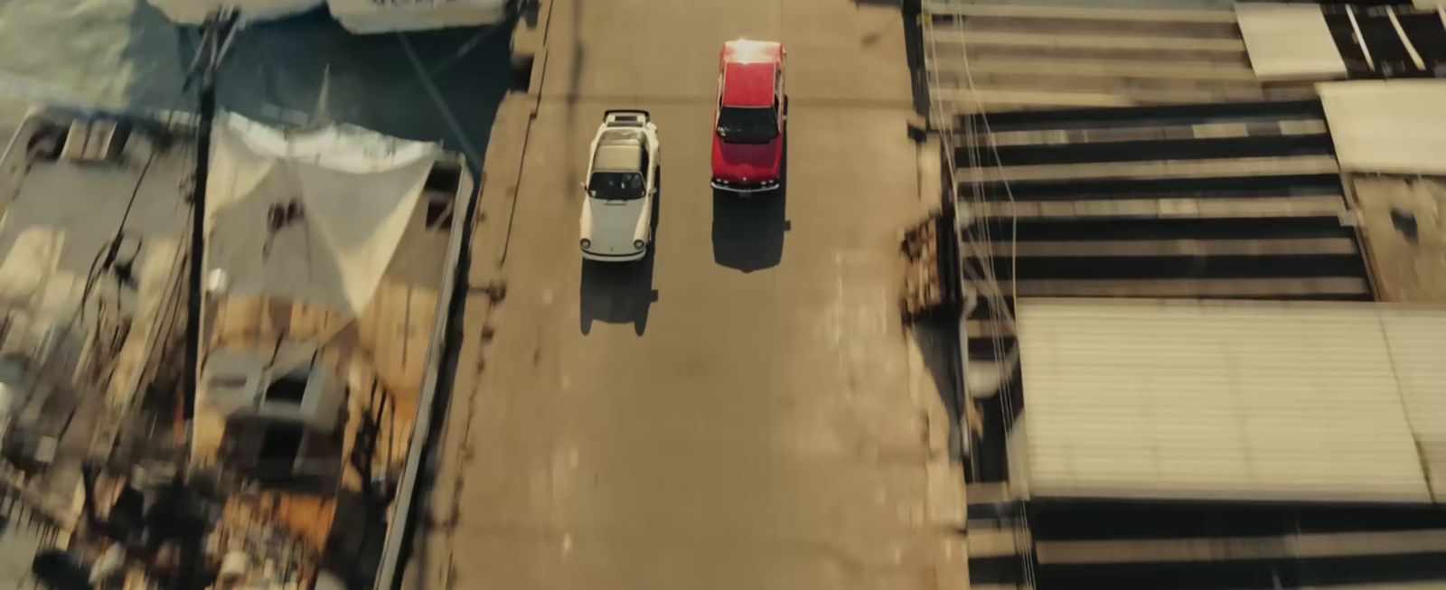 an aerial view of a car driving down a street