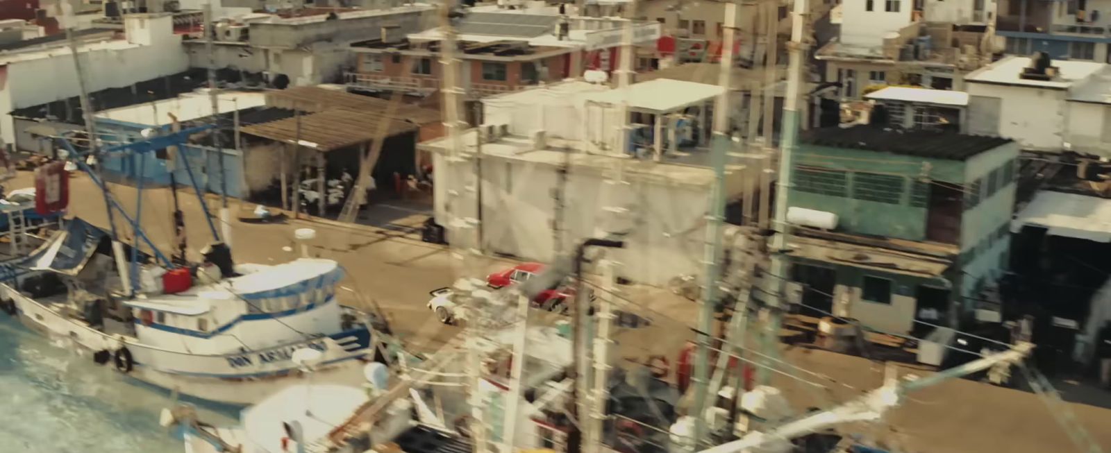 a group of boats parked next to each other in a harbor