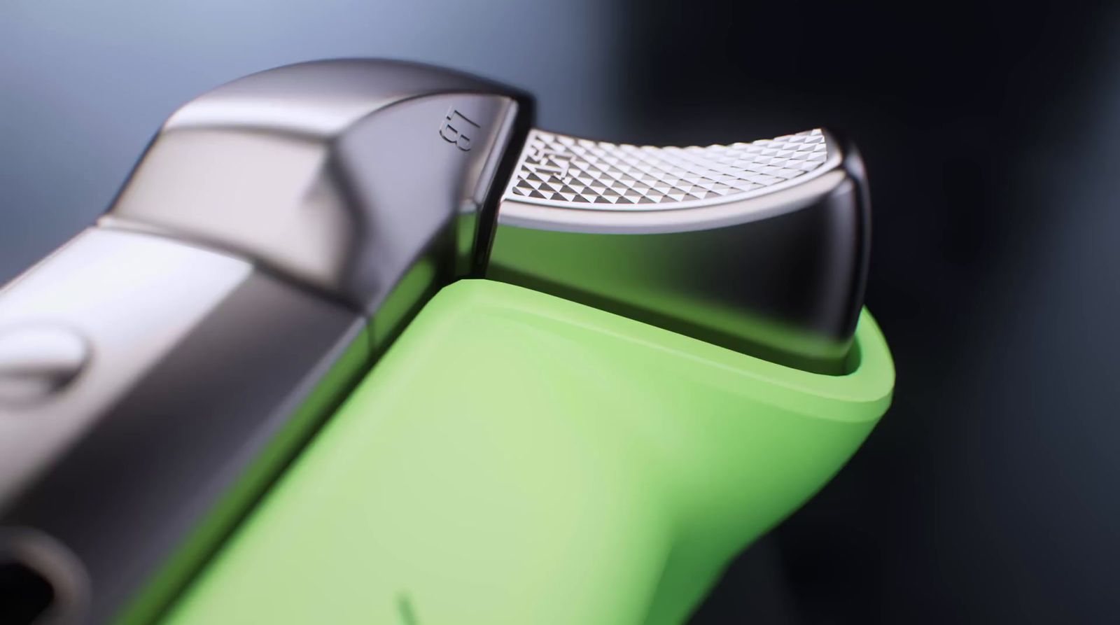 a close up of a green and black hair clipper