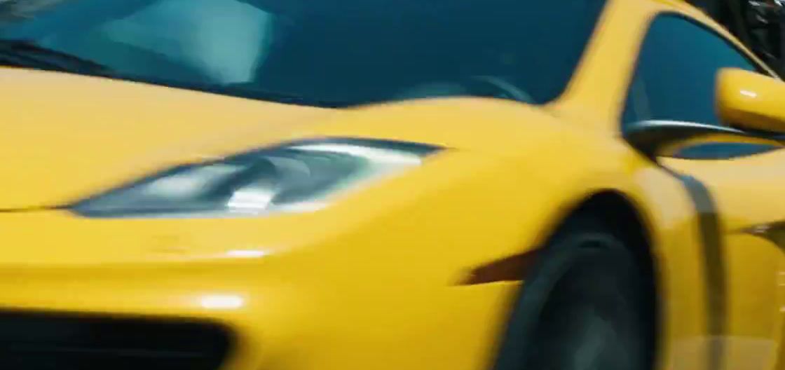 a close up of a yellow sports car