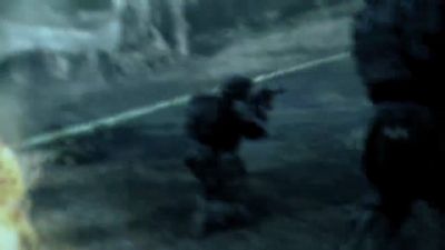 a blurry image of a man holding a gun