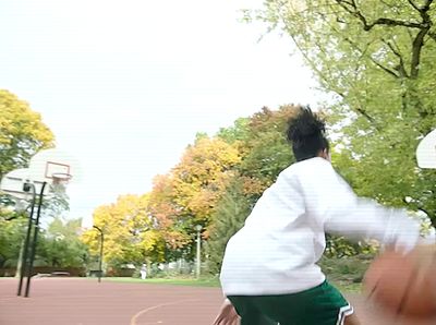 a man playing basketball on a basketball court