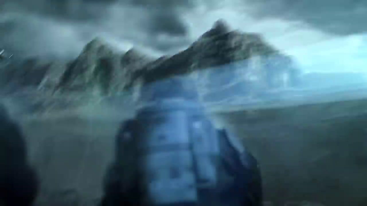 a blurry image of a man standing in front of a mountain