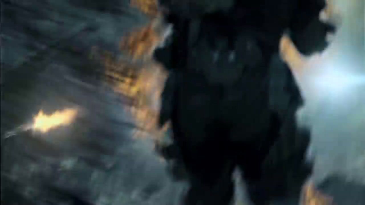 a blurry image of a man in a black suit